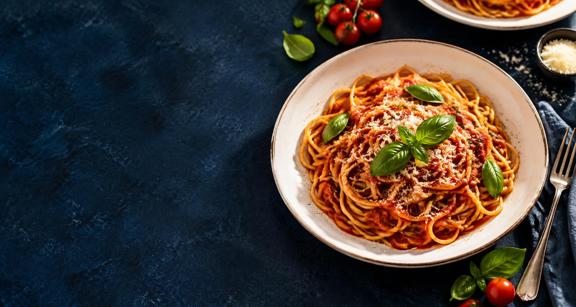 Fresh spaghetti with tomato sauce, basil, and parmesan